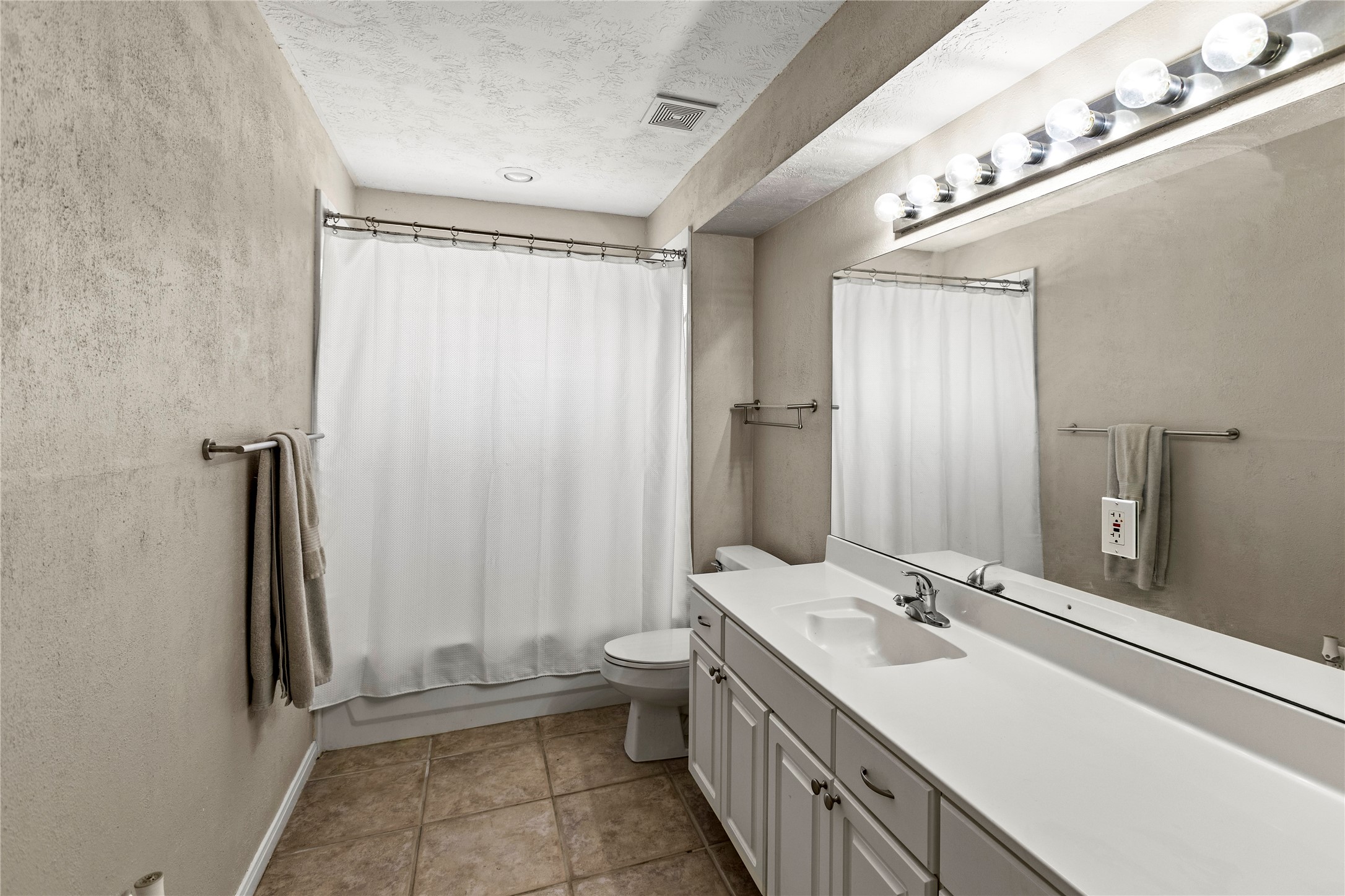 170 April Cove Conroe, TX 77356 - Photo 38 of 50 a bathroom with a double vanity sink and a mirror