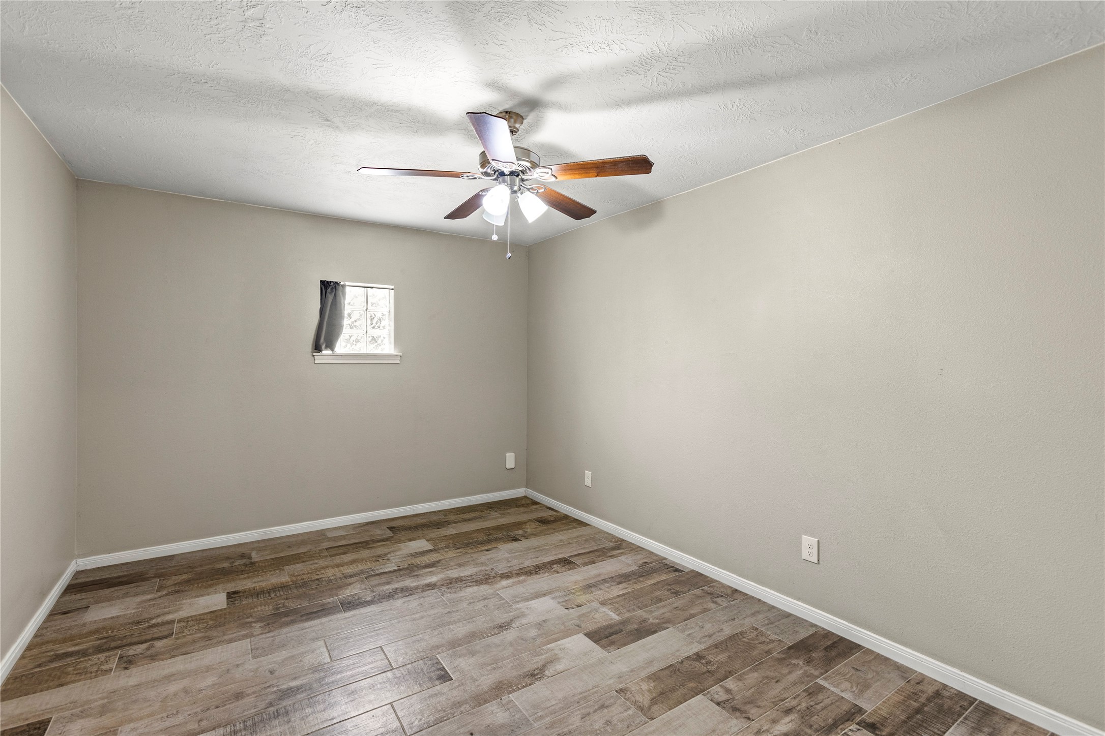 170 April Cove Conroe, TX 77356 - Photo 40 of 50 an empty room with a fan & a fan