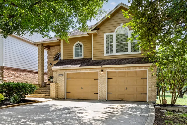 a view of a house with a garage
