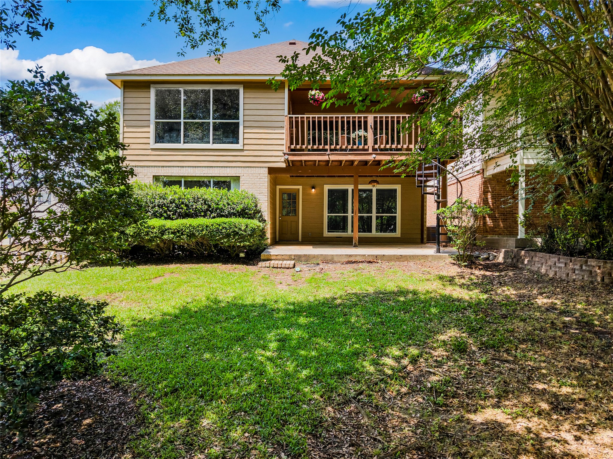 170 April Cove Conroe, TX 77356 - Photo 46 of 50 a front view of a house with a yard