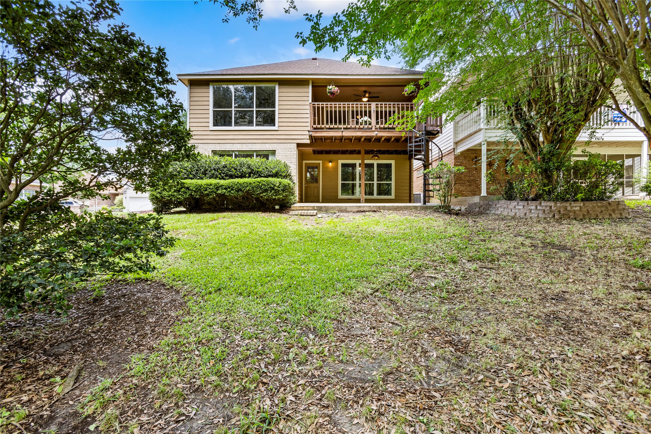 170 April Cove Conroe, TX 77356 - Photo 47 of 50 a front view of a house with a garden