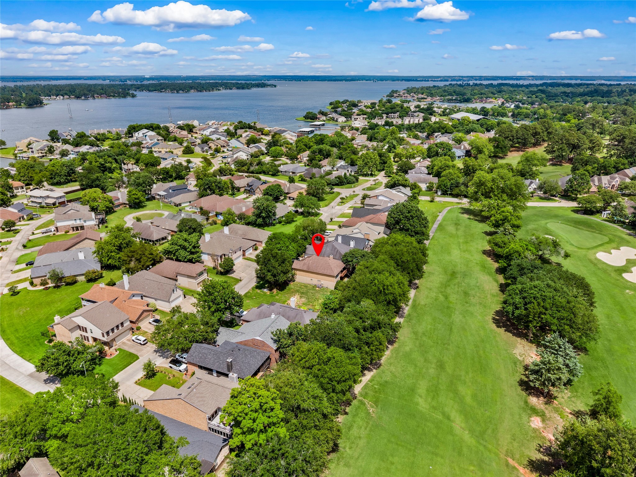 170 April Cove Conroe, TX 77356 - Photo 49 of 50 a view of a garden with a lot of flower plants and wooden fence