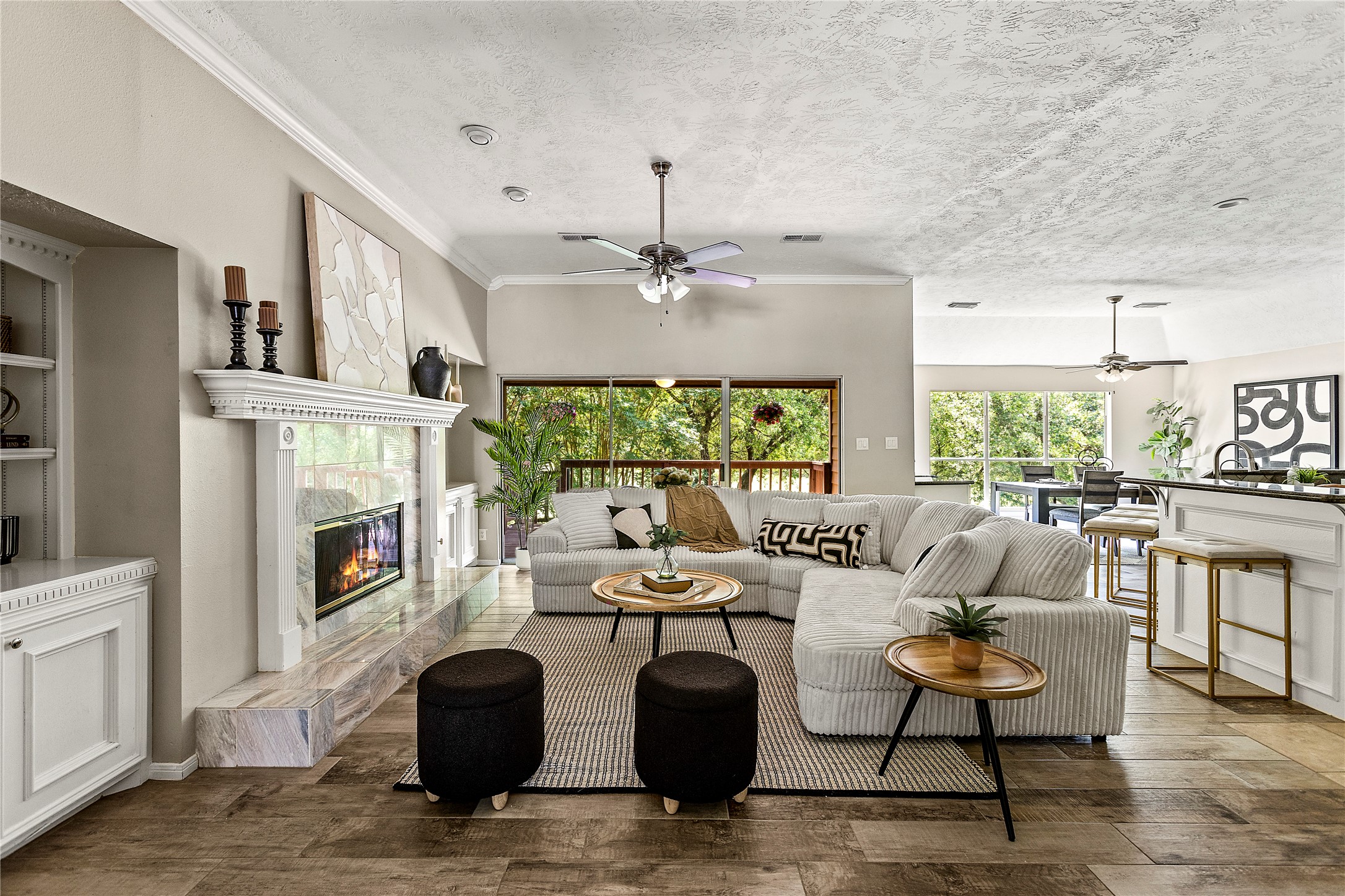170 April Cove Conroe, TX 77356 - Photo 9 of 50 a living room with fireplace furniture and a large window