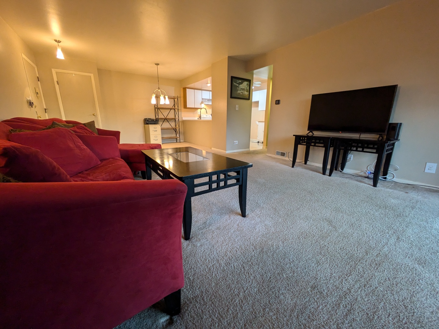 1808 Plum Grove Road, Unit 1D Rolling Meadows, IL 60008 - Photo 7 of 10 a living room with furniture and a piano