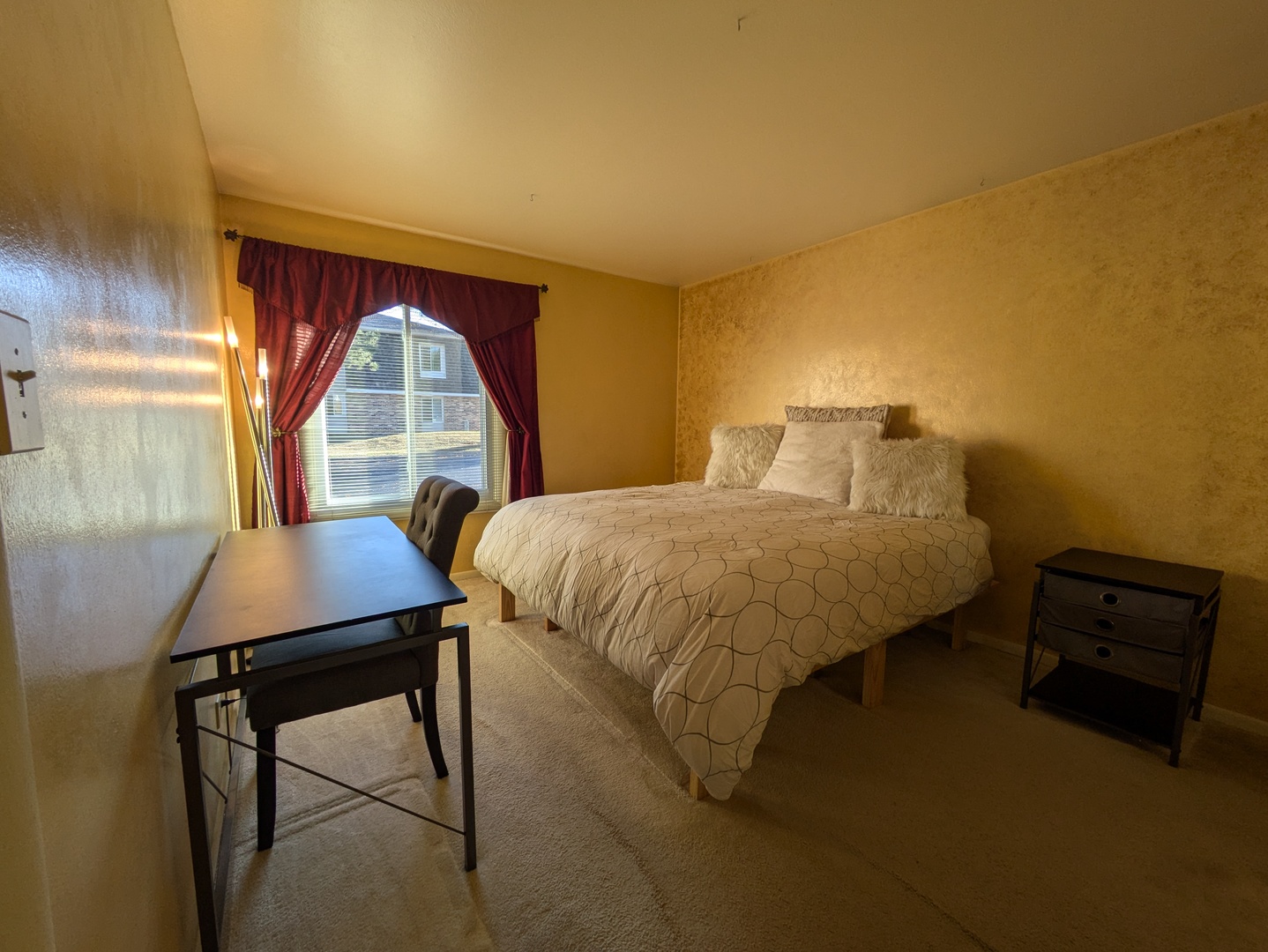 1808 Plum Grove Road, Unit 1D Rolling Meadows, IL 60008 - Photo 8 of 10 a bedroom with a bed and a table