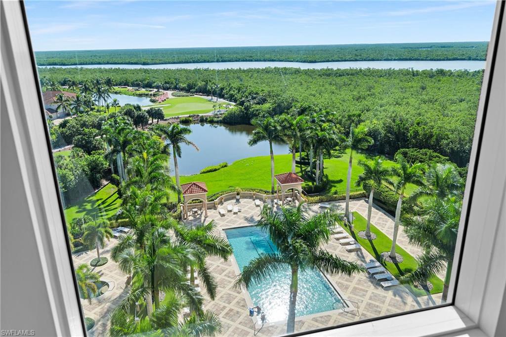 1060 Borghese Lane, Unit 803 Naples, FL 34114 - Photo 18 of 46 Bird's eye view of a pool area and a nearby body of water
