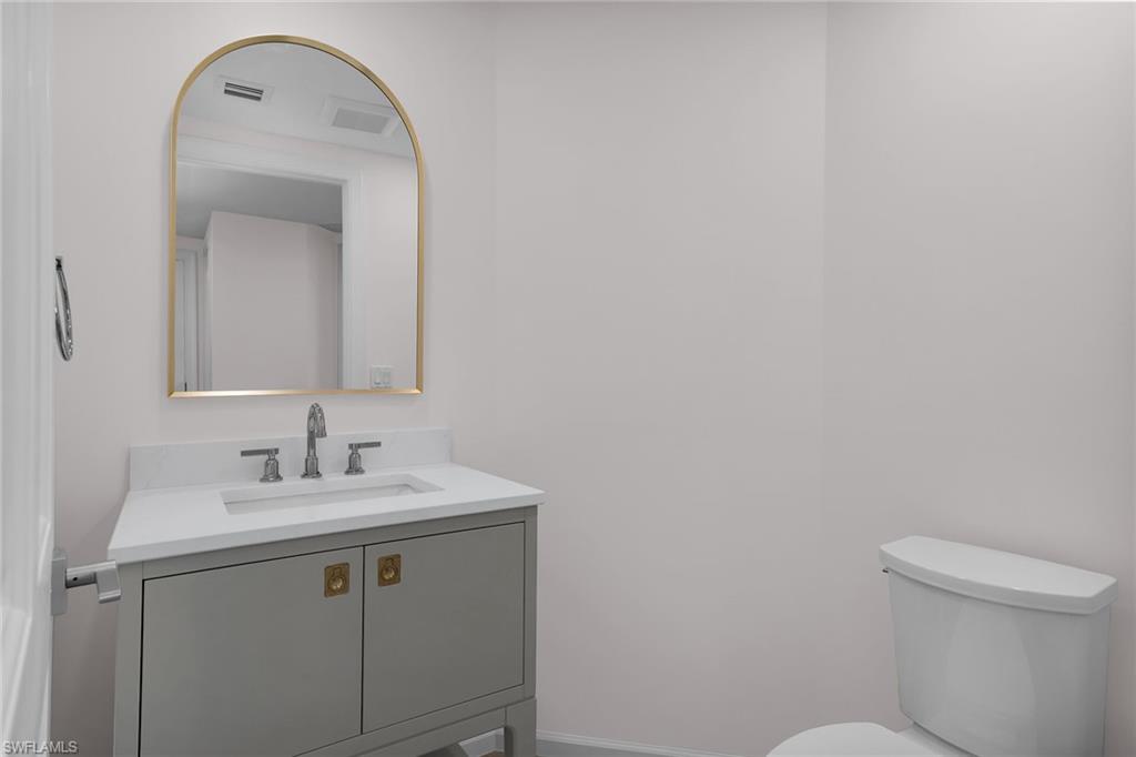 1060 Borghese Lane, Unit 803 Naples, FL 34114 - Photo 24 of 46 Bathroom featuring vanity and toilet