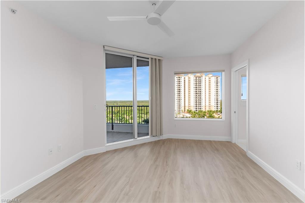 1060 Borghese Lane, Unit 803 Naples, FL 34114 - Photo 25 of 46 Empty room with light wood-type flooring and a ceiling fan