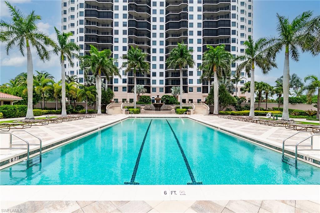1060 Borghese Lane, Unit 803 Naples, FL 34114 - Photo 32 of 46 Community pool featuring a patio area