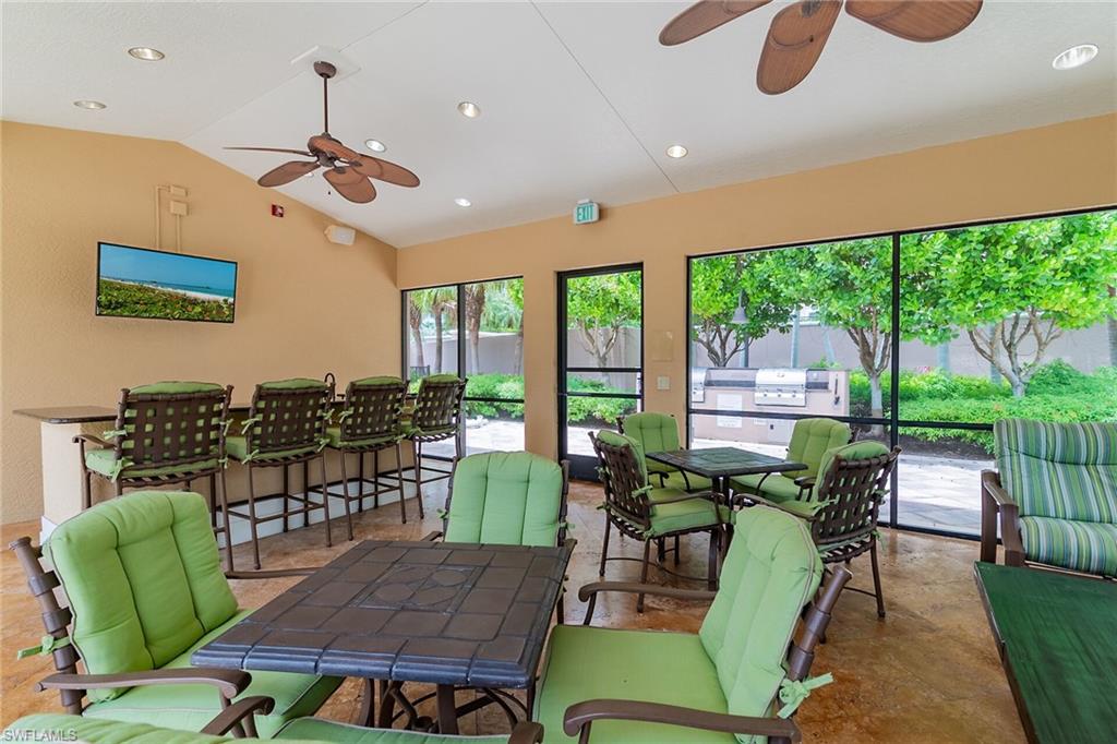 1060 Borghese Lane, Unit 803 Naples, FL 34114 - Photo 33 of 46 Sunroom / solarium featuring lofted ceiling and recessed lighting