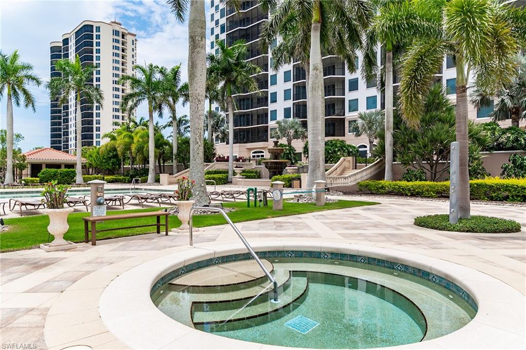 1060 Borghese Lane, Unit 803 Naples, FL 34114 - Photo 37 of 46 Community pool featuring a patio area