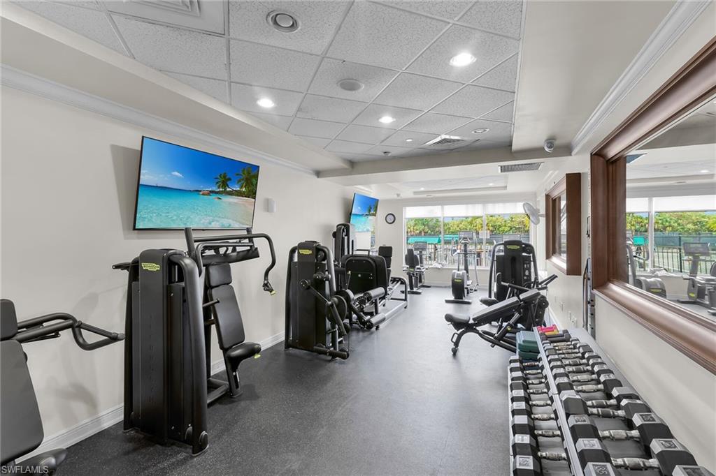 1060 Borghese Lane, Unit 803 Naples, FL 34114 - Photo 43 of 46 Exercise room with a paneled ceiling and recessed lighting