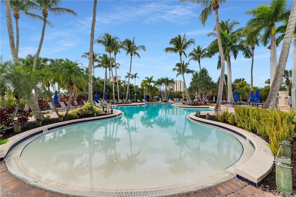 1060 Borghese Lane, Unit 803 Naples, FL 34114 - Photo 44 of 46 Community pool featuring a patio