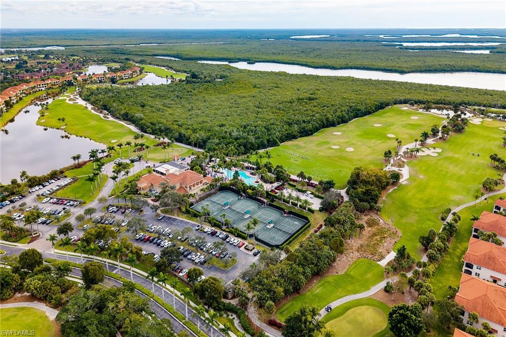 1060 Borghese Lane, Unit 803 Naples, FL 34114 - Photo 45 of 46 Aerial view of property and surrounding area with a local golf course and a nearby body of water