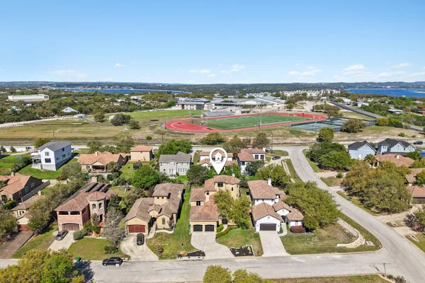 an aerial view of residential houses with outdoor space