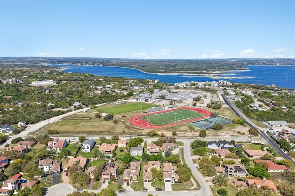 an aerial view of residential houses with outdoor space