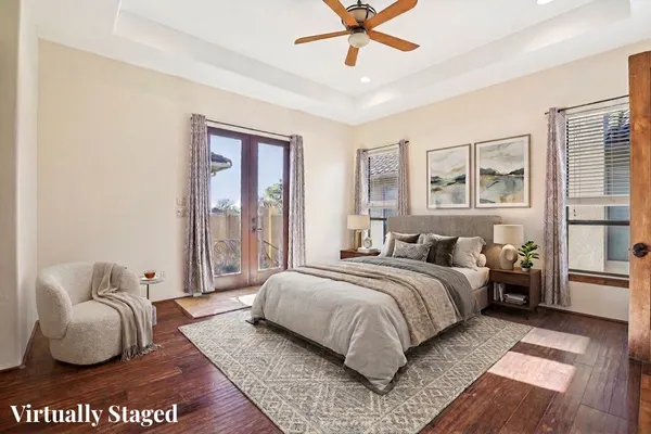 a bedroom with a bed dresser and a window