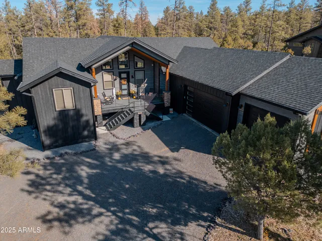 a room with two chairs and a window