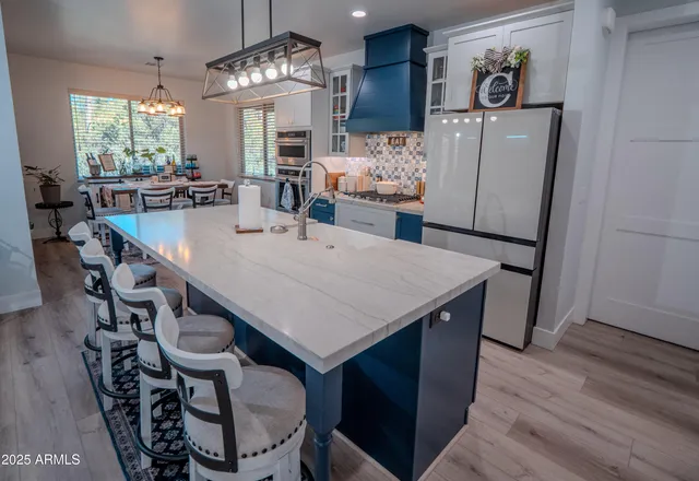 a bathroom with a sink vanity granite and a mirror