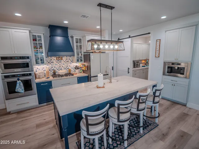 a view of walk in closet with clothes