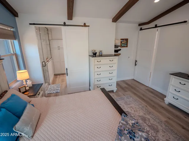 a bathroom with a double vanity sink mirror and toilet