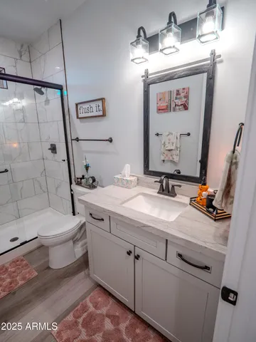 a view of a city with lots of residential buildings ocean and mountain view in back