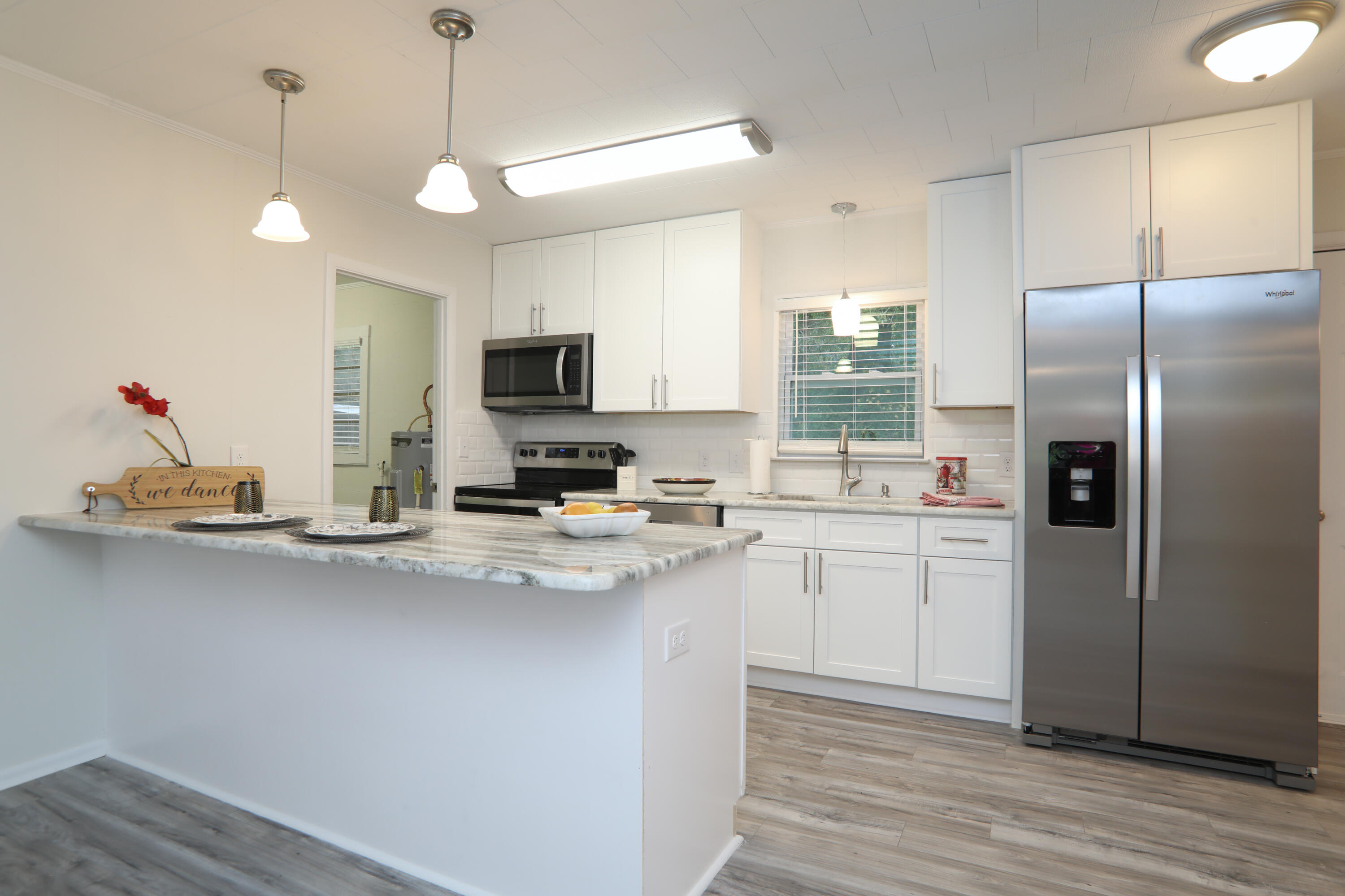 16 Pond Creek Road Crestview, FL 32539 - Photo 1 of 20 a kitchen with refrigerator and cabinets