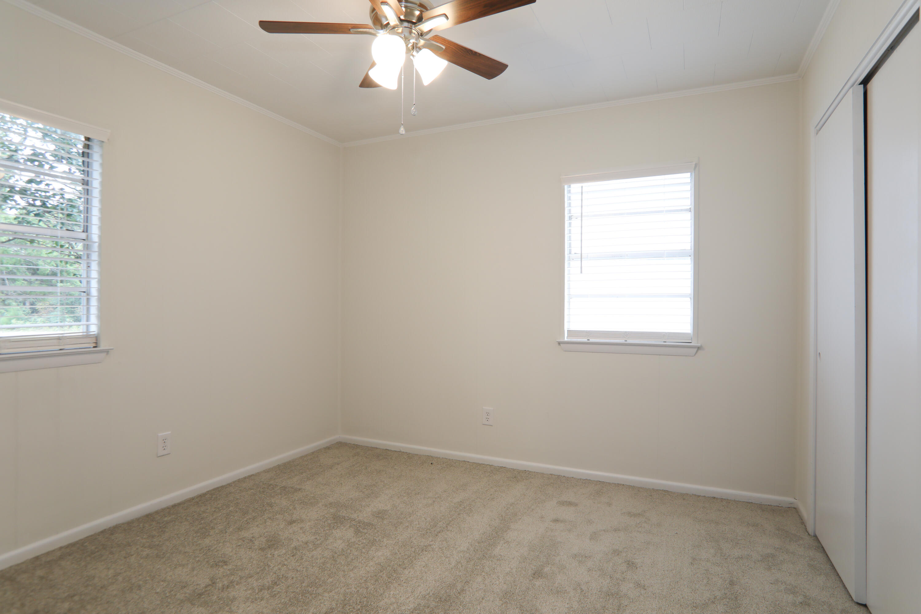 16 Pond Creek Road Crestview, FL 32539 - Photo 12 of 20 an empty room with a window and a fan