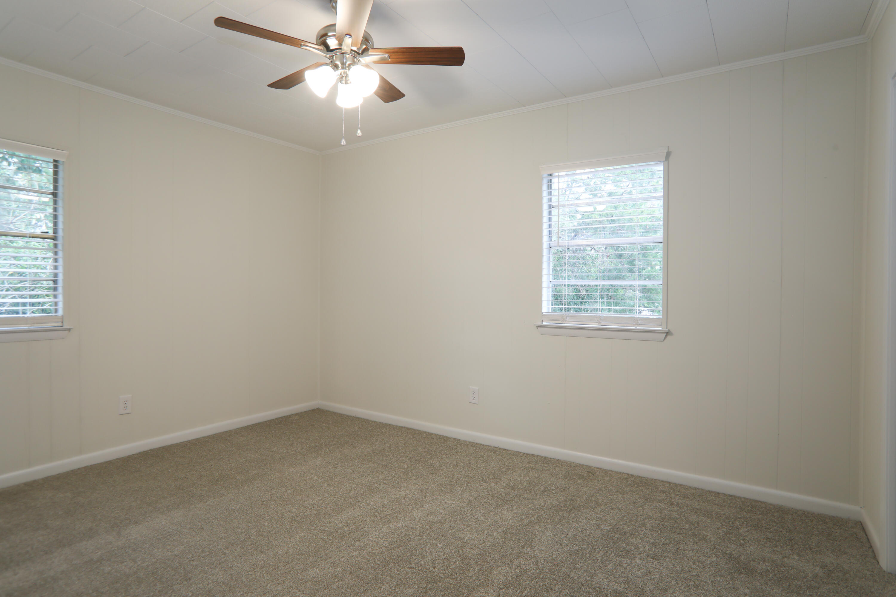 16 Pond Creek Road Crestview, FL 32539 - Photo 13 of 20 an empty room with a window and a fan