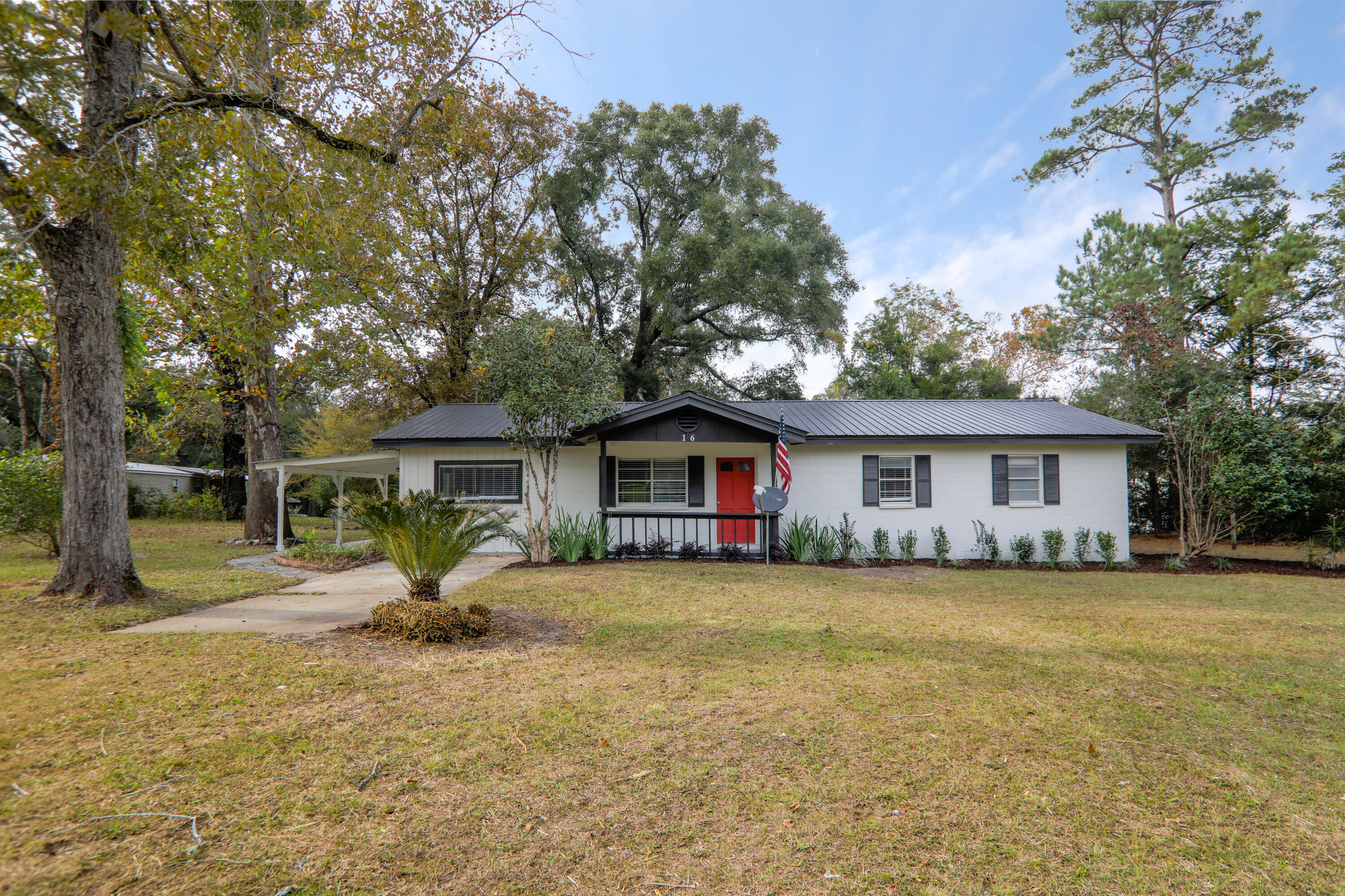 16 Pond Creek Road Crestview, FL 32539 - Photo 2 of 20 a view of a house with a yard and large tree