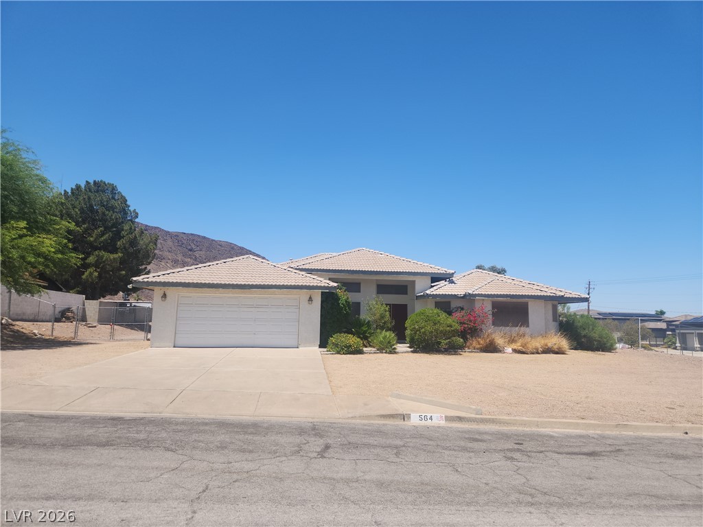 564 Ridgeway Road Henderson, NV 89015 - Photo 1 of 22 A desert-landscaped front yard with a two-car garage complements this inviting single-story home.