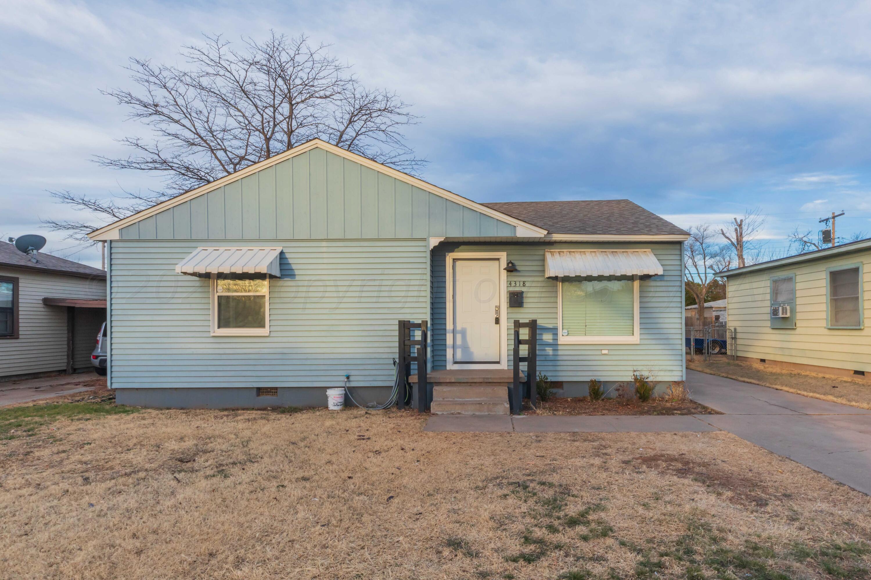 4318 South Monroe Street Amarillo, TX 79110 - Photo 1 of 36 a view of a house with a backyard and windows