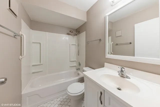 a bathroom with a sink a toilet and a bathtub
