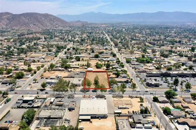 an aerial view of residential houses with city view