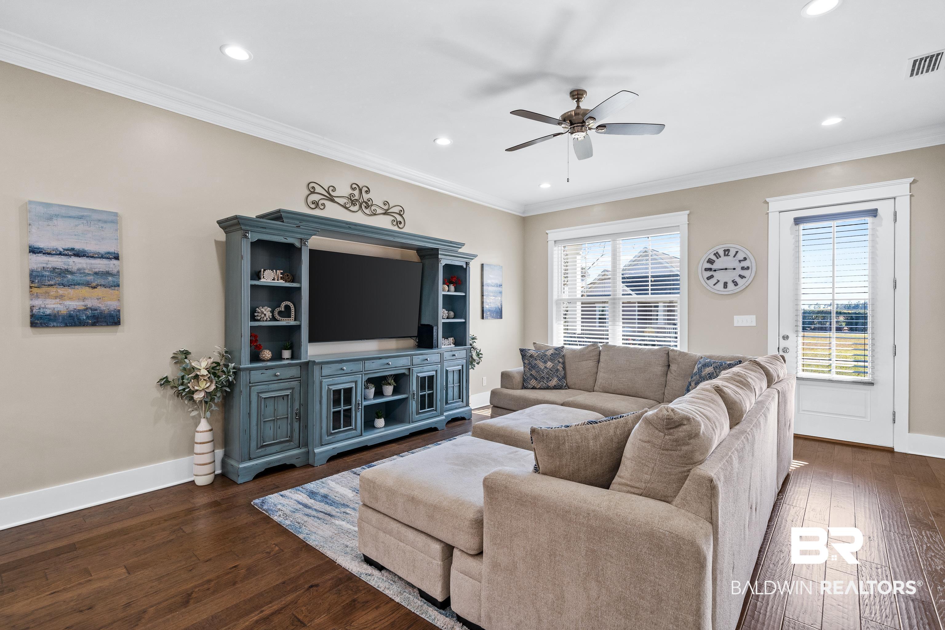 1018 Snapdragon Lane Foley, AL 36535 - Photo 6 of 37 Living room with ornamental molding, plenty of natural light, dark wood-type flooring, and ceiling fan