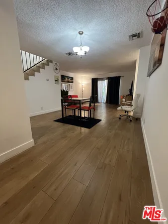a view of a dining room with furniture and window