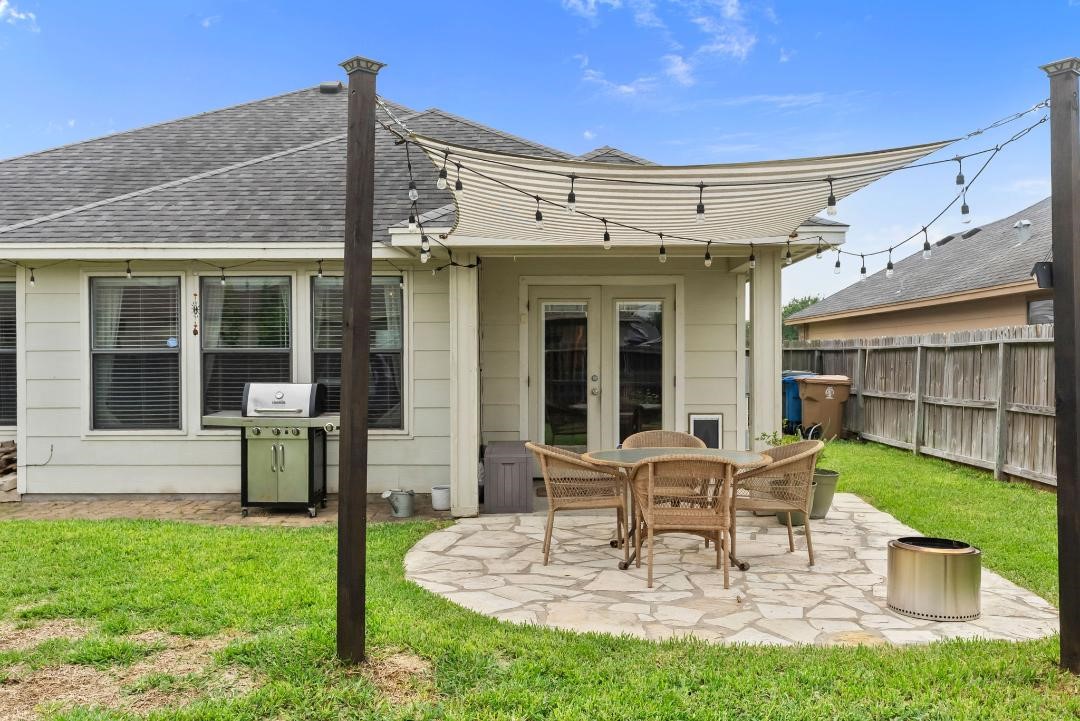 4328 Bratton Road Corpus Christi, TX 78413 - Photo 23 of 24 a view of a patio with table and chairs and potted plants