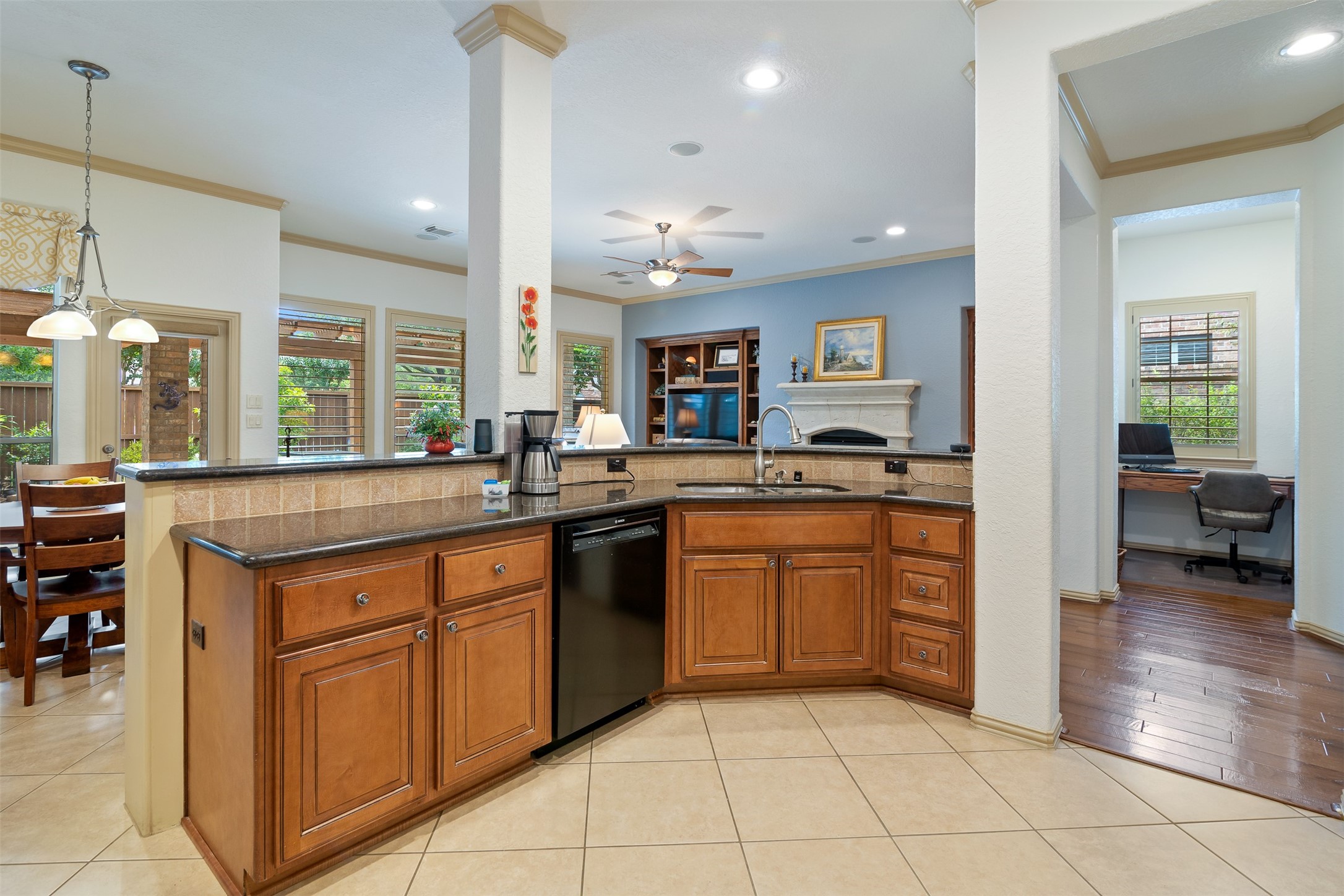 19507 Remington Manor Street Spring, TX 77379 - Photo 9 of 33 The kitchen has a spacious breakfast bar and double sided stainless steel undermount sink.