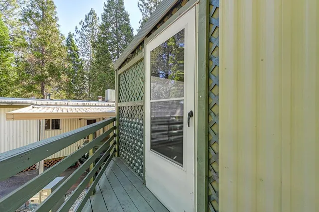 a view of balcony with furniture