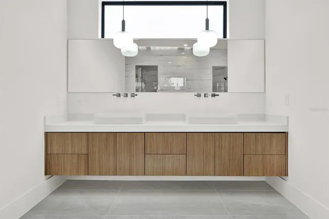 view of kitchen with a sink and mirror