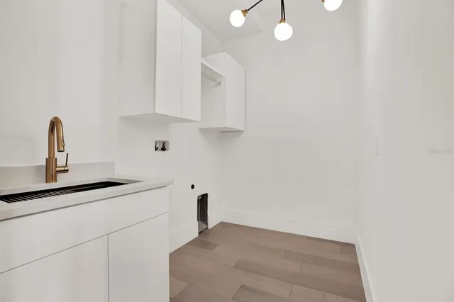 a kitchen with a sink and cabinets