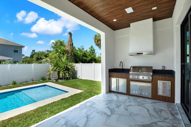 a view of a house with a yard and pathway