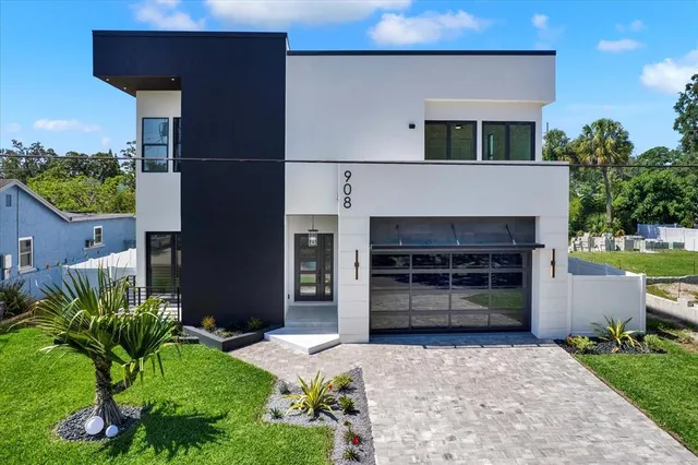 an aerial view of a houses with a city street