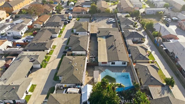 an aerial view of residential houses with outdoor space