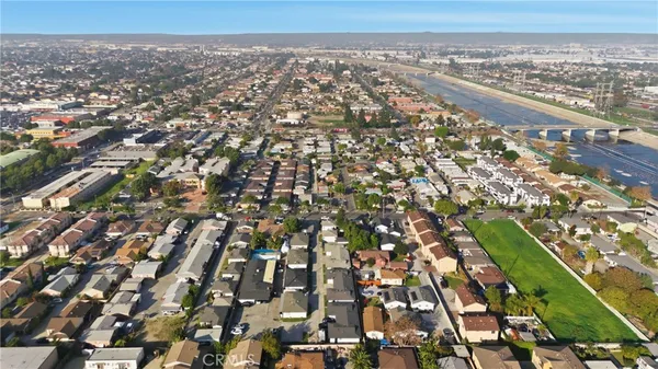 an aerial view of houses with trees