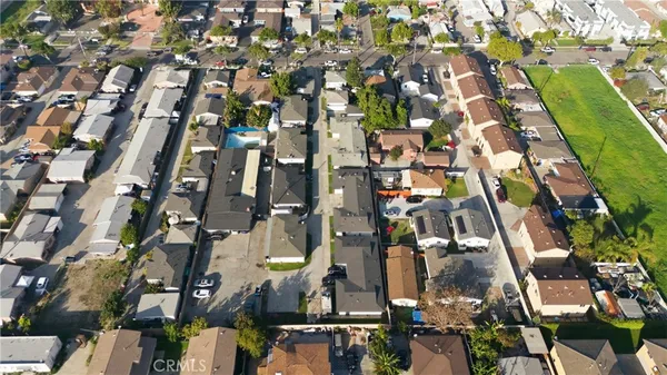 an aerial view of a house with a yard