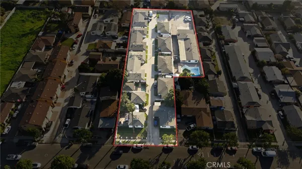 a aerial view of a house with a yard