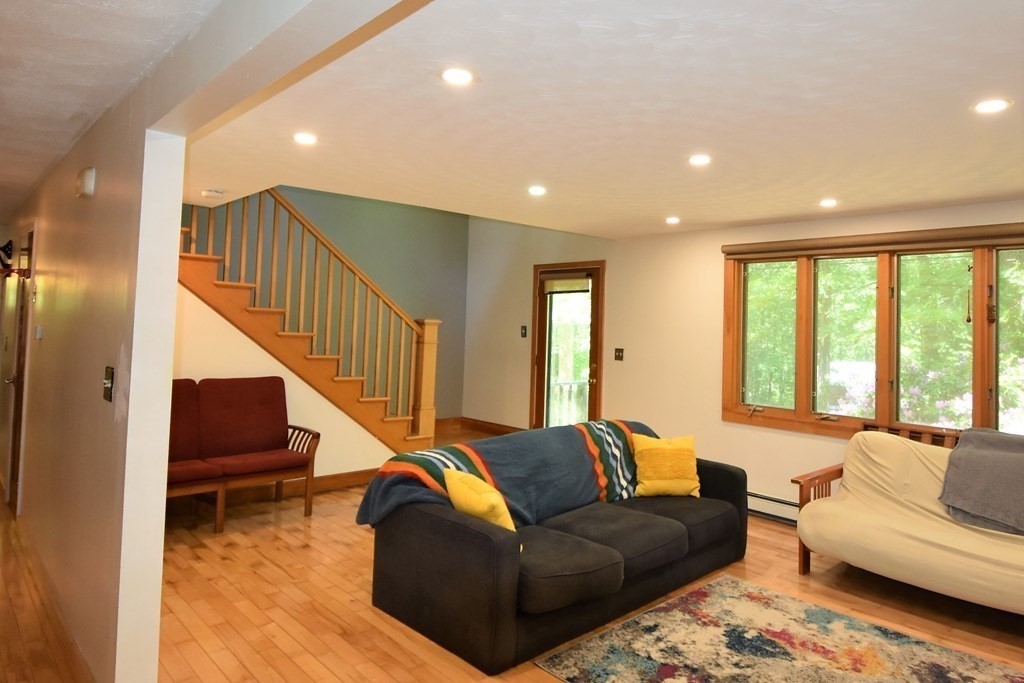 20 Amherst Road Hopkinton, MA 01748 - Photo 14 of 27 a living room with furniture or stairs and a couch