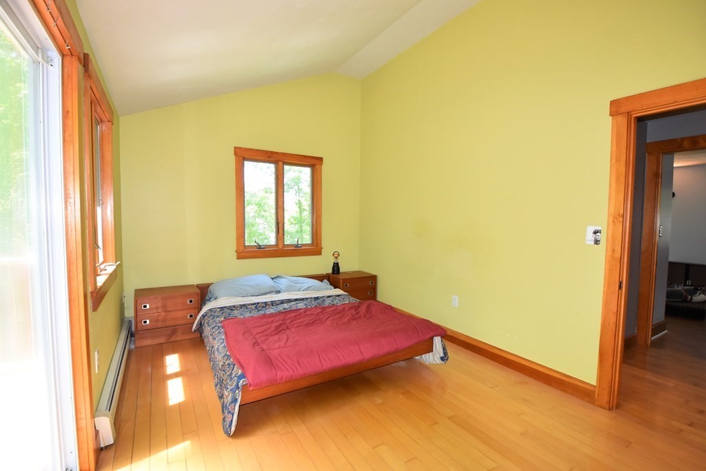 20 Amherst Road Hopkinton, MA 01748 - Photo 16 of 27 a bedroom with a bed and wooden floor