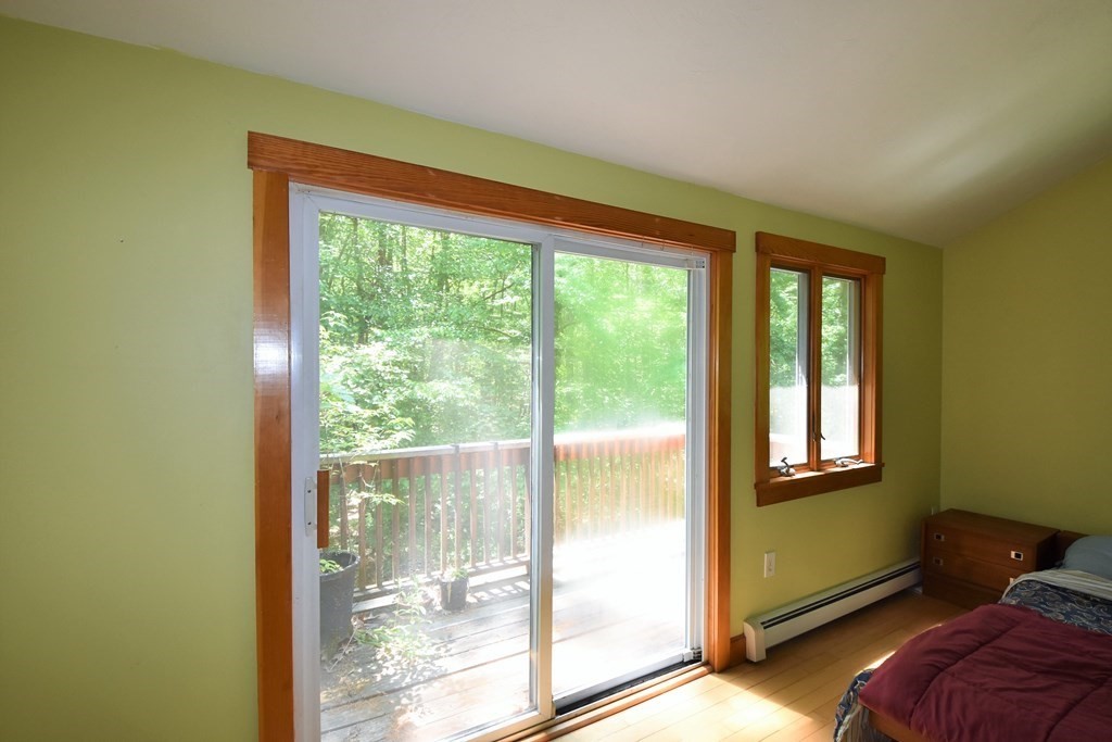 20 Amherst Road Hopkinton, MA 01748 - Photo 18 of 27 a view of a room with a large window and bed
